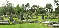 a cemetery with trees in the distance