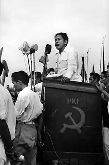 A young D. N. Aidit at an outdoor podium