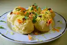 A plate of Dahi puri, crunchy fried flatbread with Dahi