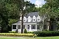 This home, built in the 1980s after the historic house on site burned, is in keeping with the older historic homes surrounding Lake DeFuniak.