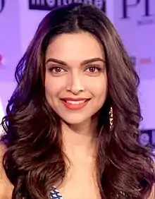 Deepika Padukone is smiling at the camera