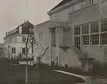 Two concrete 2-story dwellings