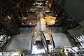 Discovery being lowered onto its external fuel tank and solid rocket boosters in High Bay 3 of the Vehicle Assembly Building.