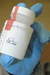 Drug test bottle with authentication seal