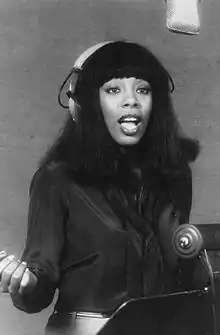 Image 4Donna Summer wearing headphones during a recording session in 1977 (from Recording studio)