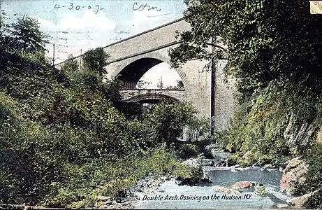 Two arched bridges cross Sing Sing Kill in Ossining.  Broadway is carried on the lower bridge, while the Croton Aqueduct was carried on the upper one