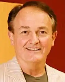 Clean-shaven man with greying hair