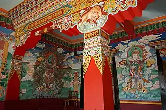 Thankas painted on the walls of Drepung