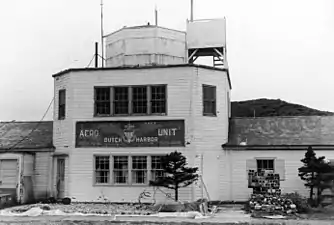 The building at Dutch Harbor airport was used as a communication room and terminal with the old U.S. Navy Aero Unit insignia in August 1972