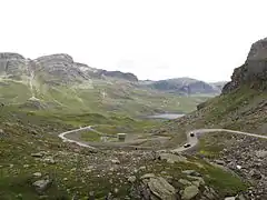 Overview from just south of the tunnel beyond Dyrskar. The road from 1919 snakes its way up the valley. The current E134 inside concrete culvert with a tower in the middle of the picture.