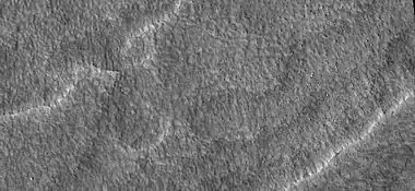 Close-up of scalloped ground, as seen by HiRISE under HiWish program. Surface is divided into polygons; these forms are common where ground freezes and thaws.  Note: this is an enlargement of a previous image.