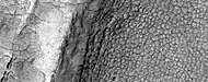 High-center polygons, as seen by HiRISE under HiWish program  Image is of the top of a debris apron in Deuteronilus Mensae.