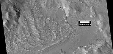 Glacier coming out of valley, as seen by HiRISE under HiWish program Location is rim of Moreux Crater.  Location is Ismenius Lacus quadrangle.