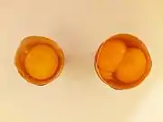 Comparison of an egg and an egg with a double-yolk (opened)