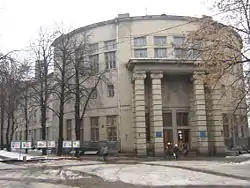 Round, gray Electrotechnical Building with high-pillared entrance