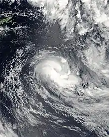 An organized area of low pressure with convection wrapping around the center