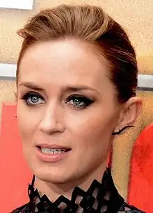 A face shot of Emily Blunt as she looks away from the camera