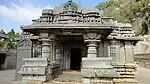 Porch entrance to Akkana Basad with the awning supported by half pillars with old Kannada inscription on the side.