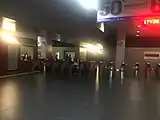 The fare gates and information counter on the ground level.