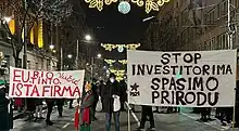 Demonstrators with two banners in Belgrade on 27 January 2022