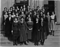 Ethel McCollough, center, poses with library staff on the steps of the Coliseum