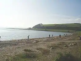 A curved bay with a sandy foreshore