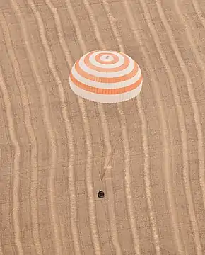 The Soyuz TMA-18 with its main parachute deployed for landing on 25 September 2010.