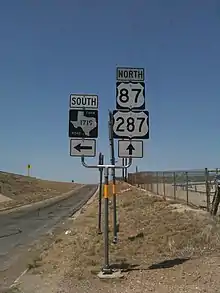 Route marker: FM 1719 route marker in Potter County (left) alongside route markers for U.S. 87 and U.S. 287 (right)