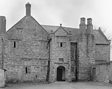 Greyscale image of the Fferm farmhouse's entrance