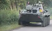 American, Serbian, and German soldiers on a Romanian armored personnel carrier during the "Rapid Trident-2012" exercise, on July 17, 2012.