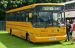 A First Student UK school bus painted in American school bus yellow