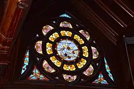 One of the four dormer windows in the roof of the main auditorium