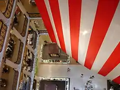 Looking down the northwest atrium with the edge of the hanging American flag in Marshall Field's