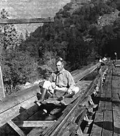 A United States Forest Service employee "shoots the chute."