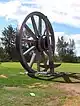 View of large wheel and pick axe at Fort Assiniboine