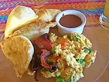 Fry jacks are Belizean deep-fried dough pieces served for breakfast, and can be shaped as circles or triangles.