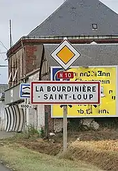 A sign showing the entrance to La Bourdinière-Saint-Loup