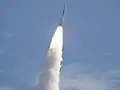 Fire and smoke light up a blue sky as a United Launch Alliance Delta II Heavy rocket propels GRAIL into space.