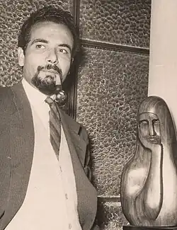 El Sagini in one of his exhibitions with his trade mark pipe