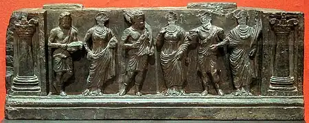 Gandhara frieze with devotees, holding plantain leaves, in purely Hellenistic style, inside Corinthian columns, 1st–2nd century CE. Buner, Swat, Pakistan. Victoria and Albert Museum