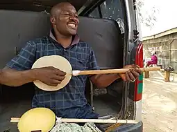 Niger and northern Nigeria. Hausa musician playing a Garaya