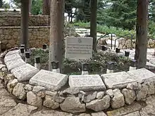 Empty graves with memorial stones.