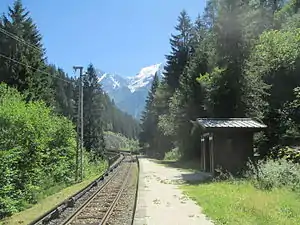 Shelter on side platform next to single-tracked railway line