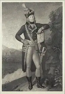 Black and white print of a man standing and holding a map in his hand. He wears a French officer's military uniform of the 1790s with bicorne hat, dark coat with lace trim and a long tail, tight white breeches, black boots and a sword.