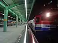 A goods train passing through at night