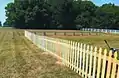 A gothic-style picket fence built using pressure treated pine