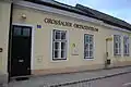 "Ortszentrum Grossau" community centre building, housing the fire station, a kindergarten, and a community function room