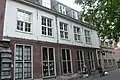 The shops in what was once known as the St. Joris Doelen, today called the Proveniershuis. The paintings of the civic guard of St. George by Frans Hals once hung in these two buildings (the building on the right corner was the meeting hall with the residence of the castelein or keeper attached).