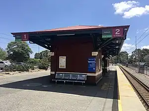 Small maroon brick platform shelter