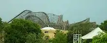 Gwazi as captured from the park's transportation Skyride with the full layout. A Lion train can be seen descending its initial drop.